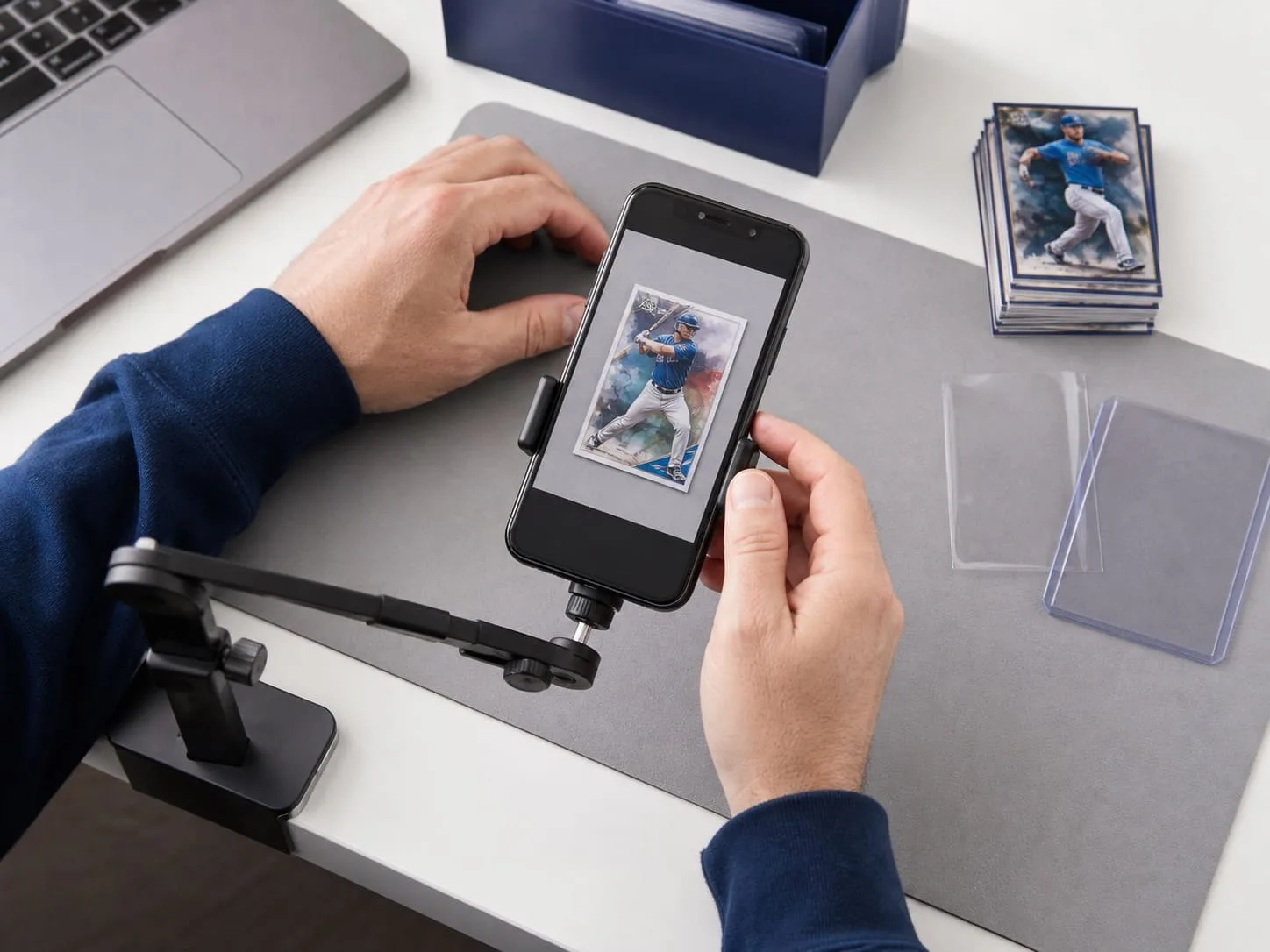 Seller photographing a fictional baseball card on a clean capture mat